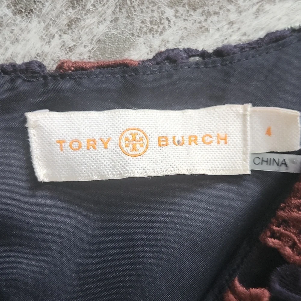 Tory Burch zips back